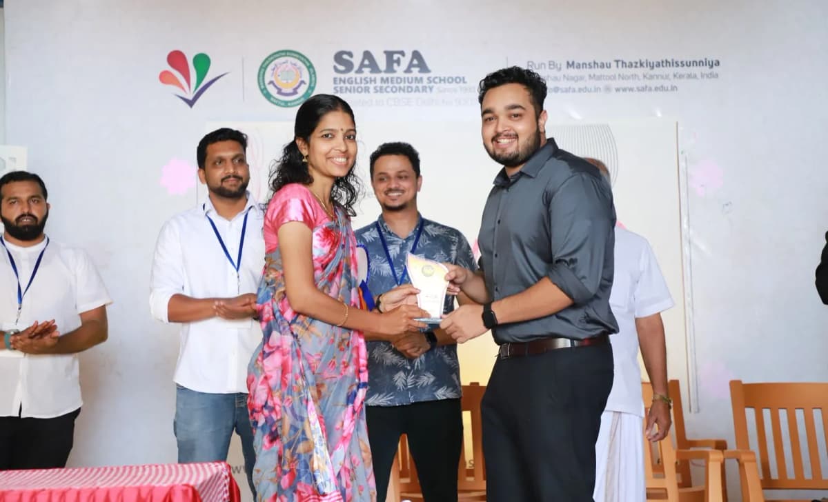 Receiving an award at SAFA English Medium School